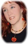 Artist Modeling the  Pumpkin Earring/Necklace Set