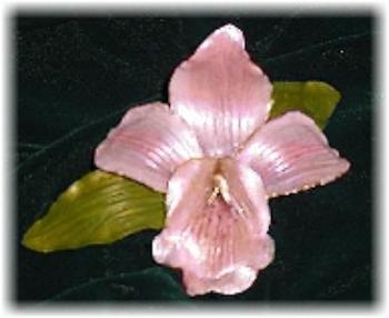 This porcelain handmade, hand-painted orchid pin  is painted in translucent light pink and gold enamel details. This beautiful pin comes in a box ready for display or to give. Unique design, one-of-a-kind ! 100% handmade